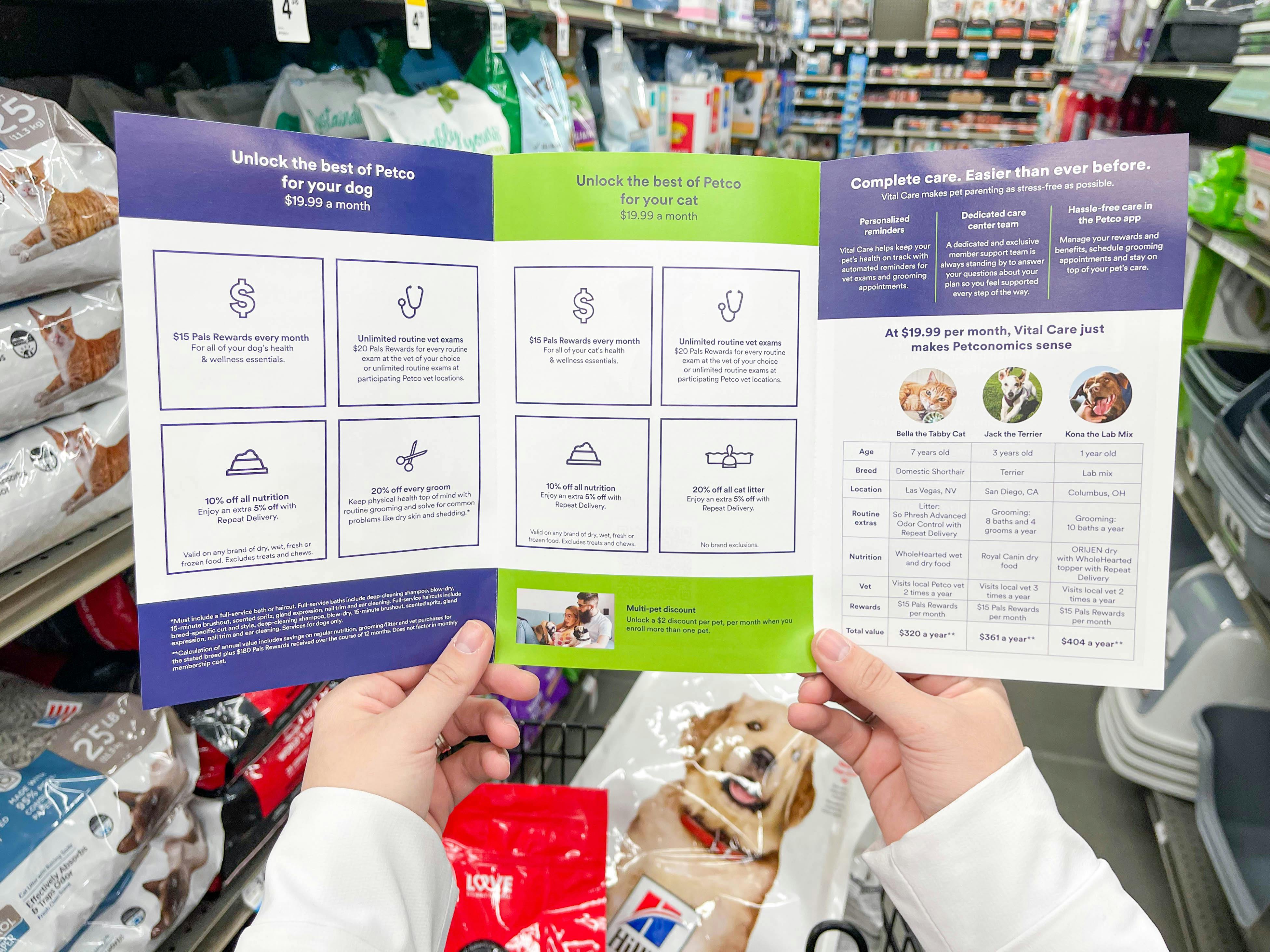 a person looking at a brochure in store for petco vital care