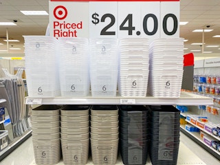 An end-cap shelf at Target displaying 6-packs of storage bins in different colors, advertised as $24.00 above the shelf.