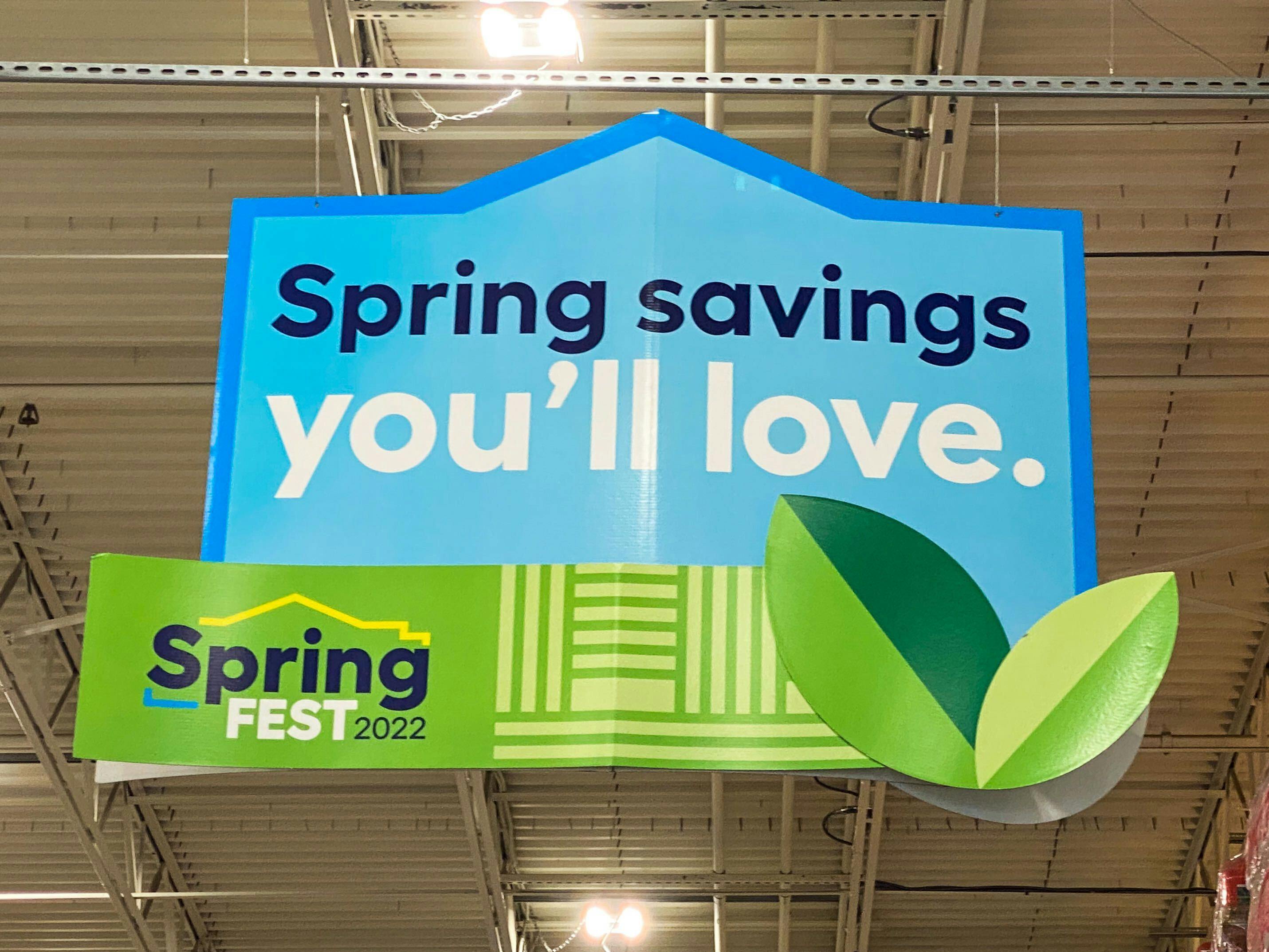 A hanging sign for Lowe's 2022 SpringFest that says, "Spring savings you'll love