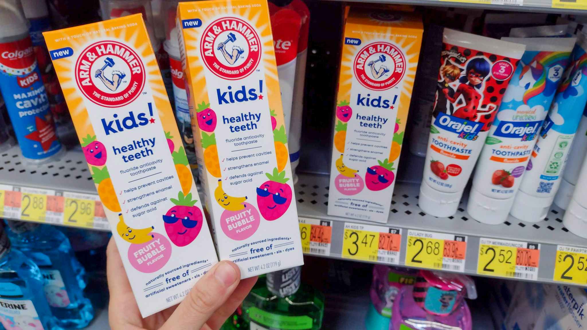 walmart arm and hammer kids toothpaste hand holding