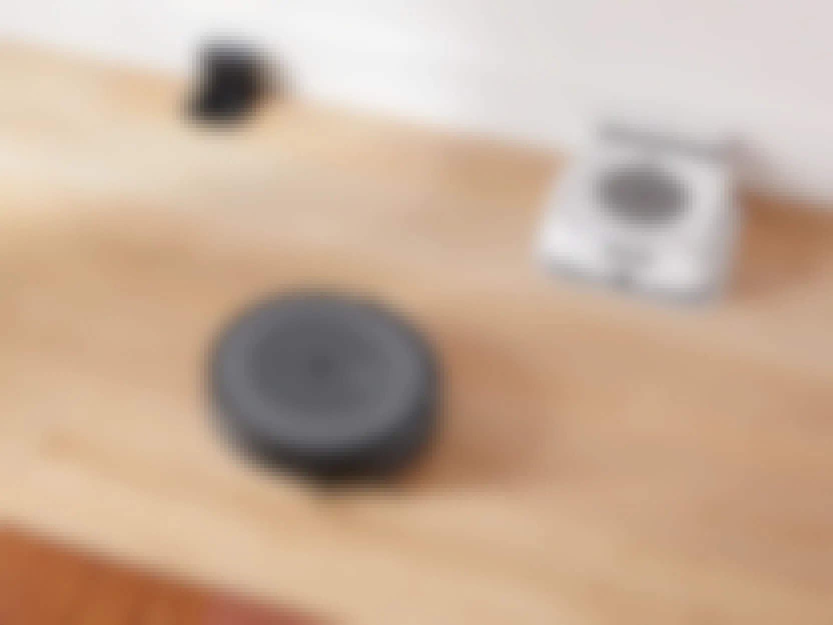 Amazon iRobot Roomba vacuum on a hardwood floor