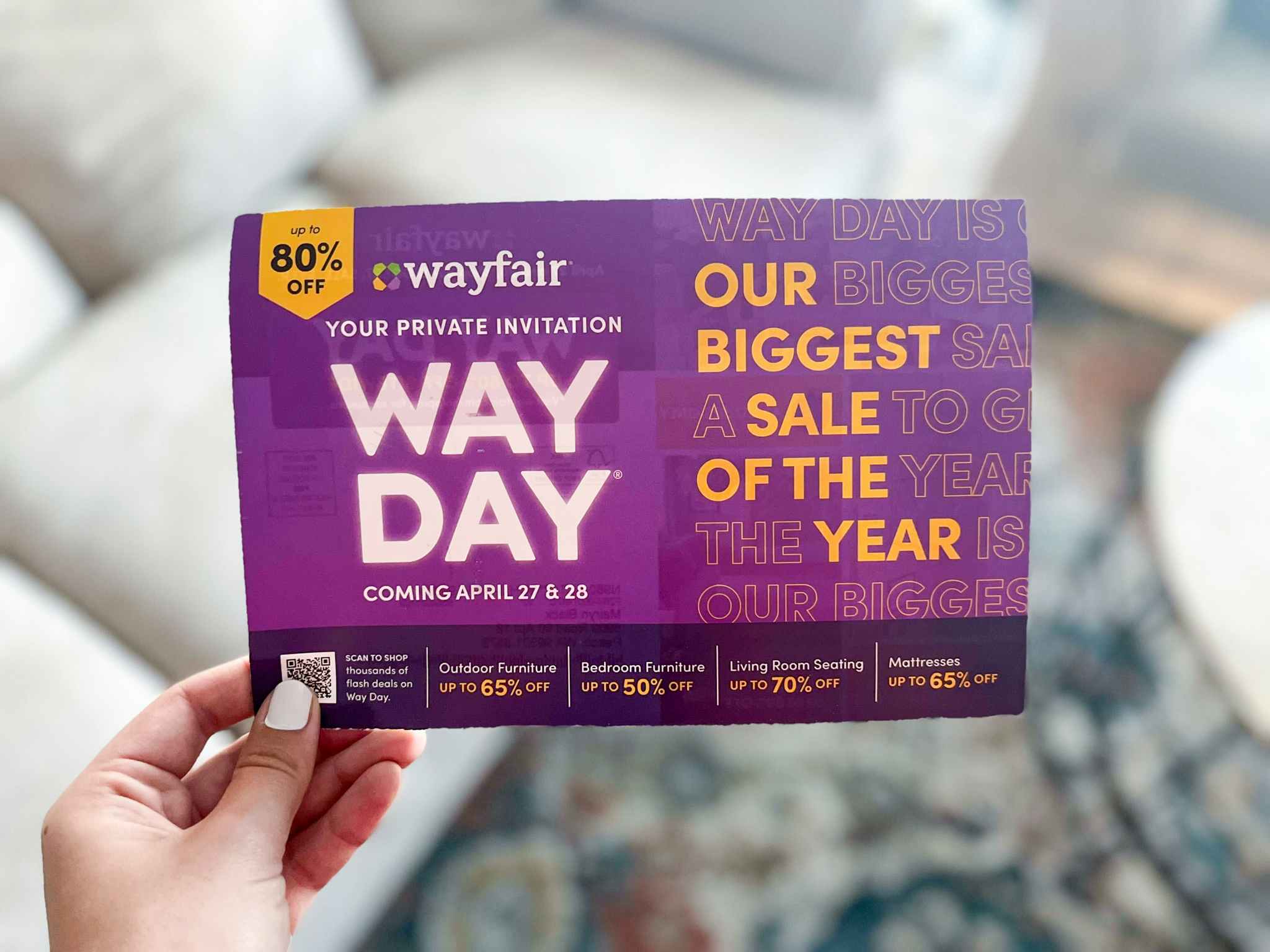 hand holding a private invitation mail flyer for the Wayfair Way Day sale event