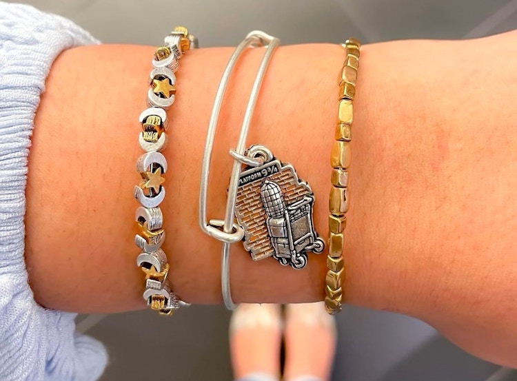A Harry Potter bracelet on a woman's wrist 