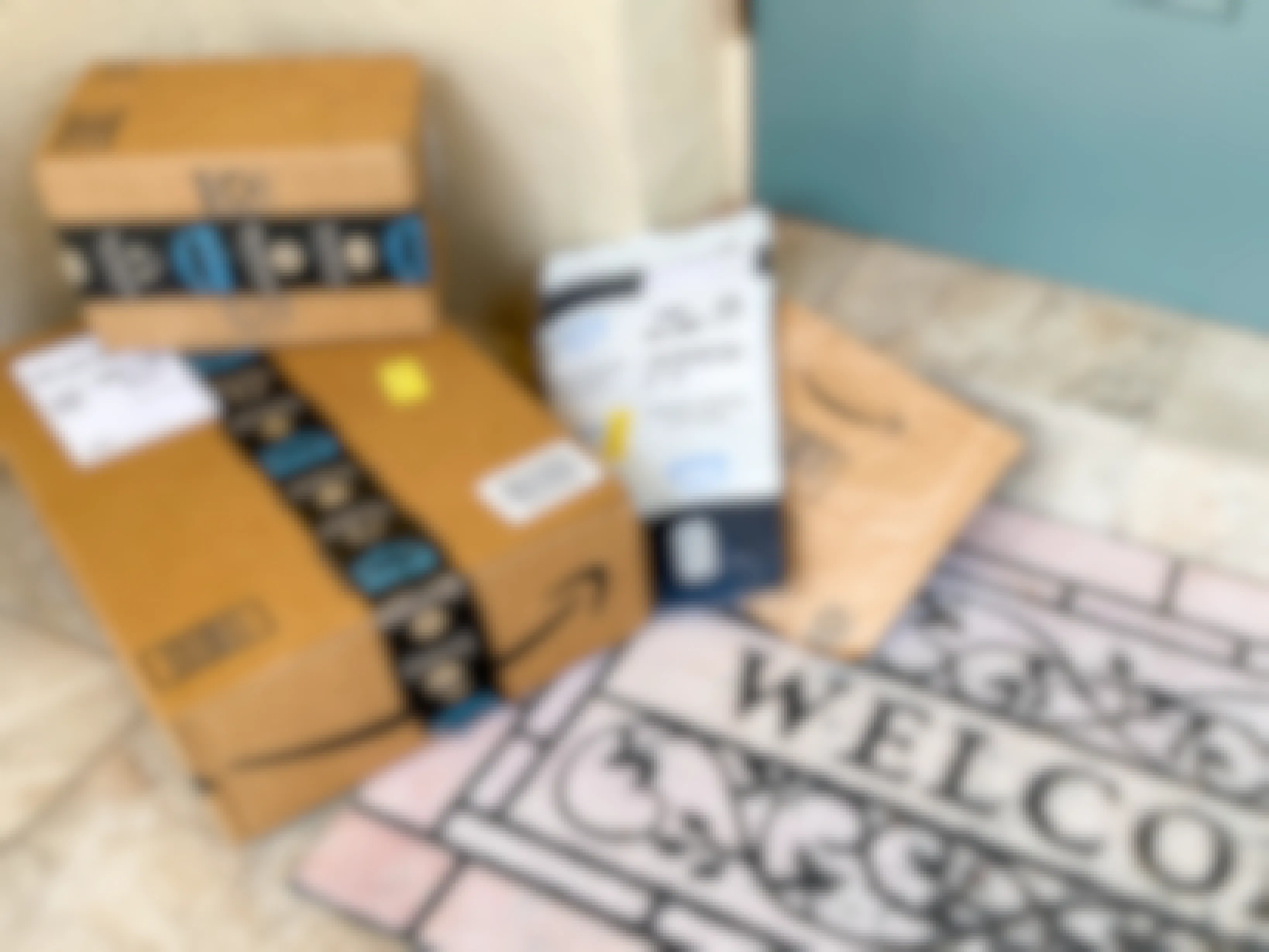 Amazon boxes sitting next to a doorstep.