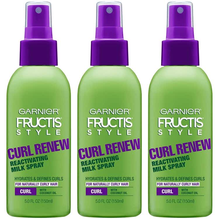 A set of three Garnier Fructis hair sprays.