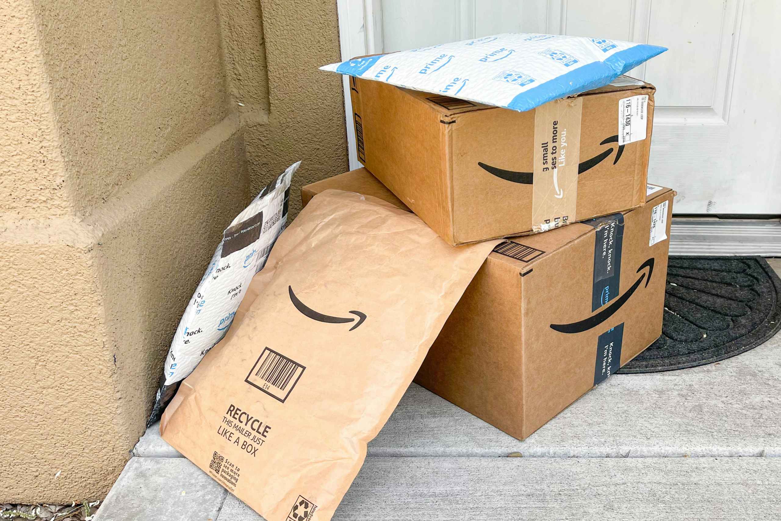 amazon packages and boxes on front porch