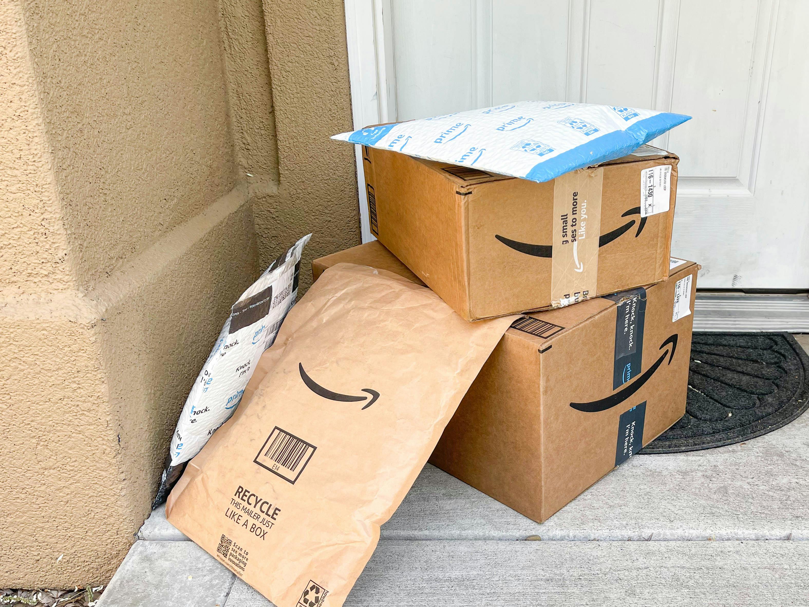 amazon packages and boxes on front porch
