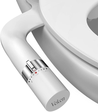 A bidet attached to a toilet.