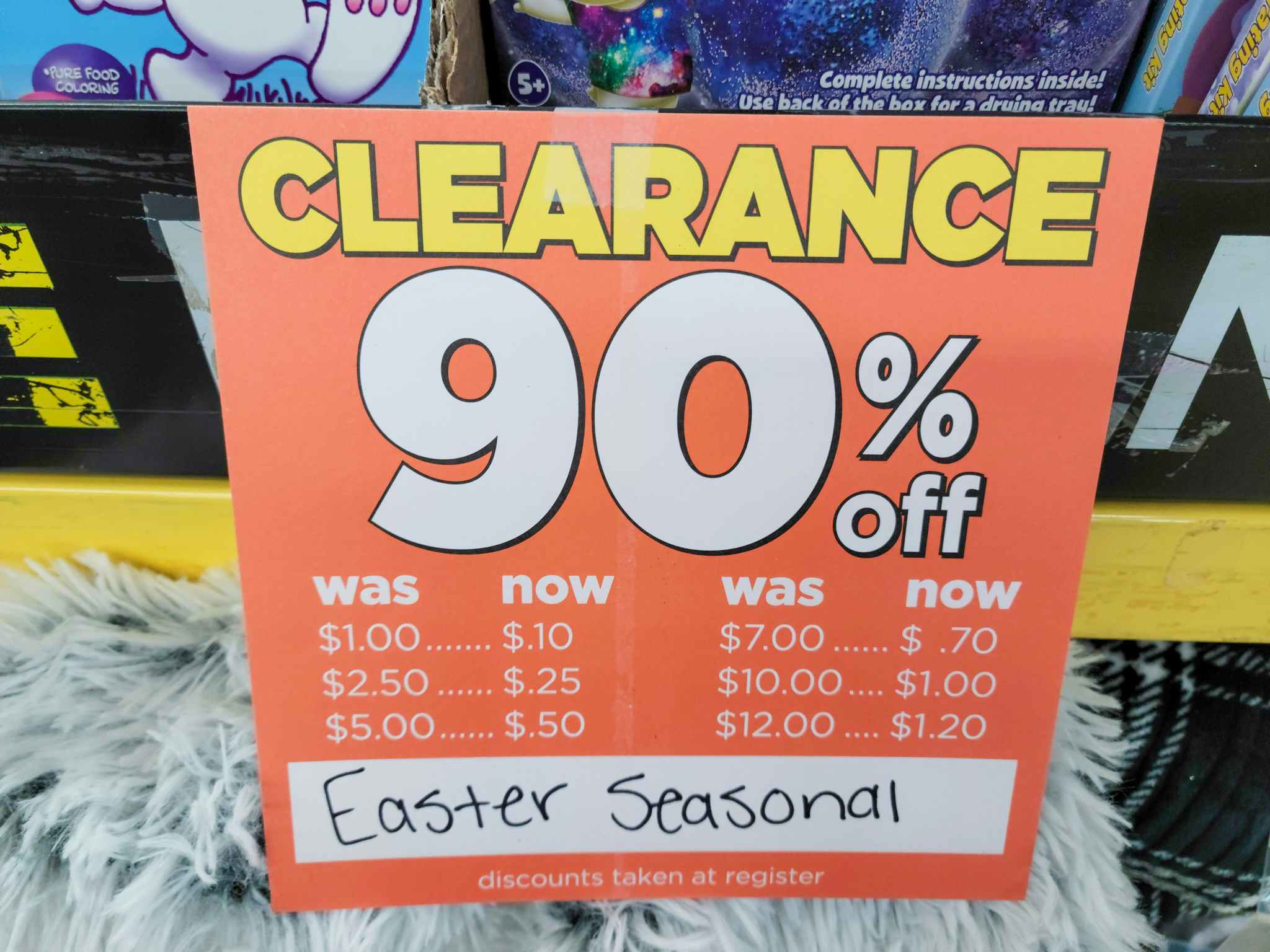 A sign for 90% off Easter Seasonal items at Dollar General