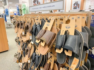 mens sandals on hangers in store