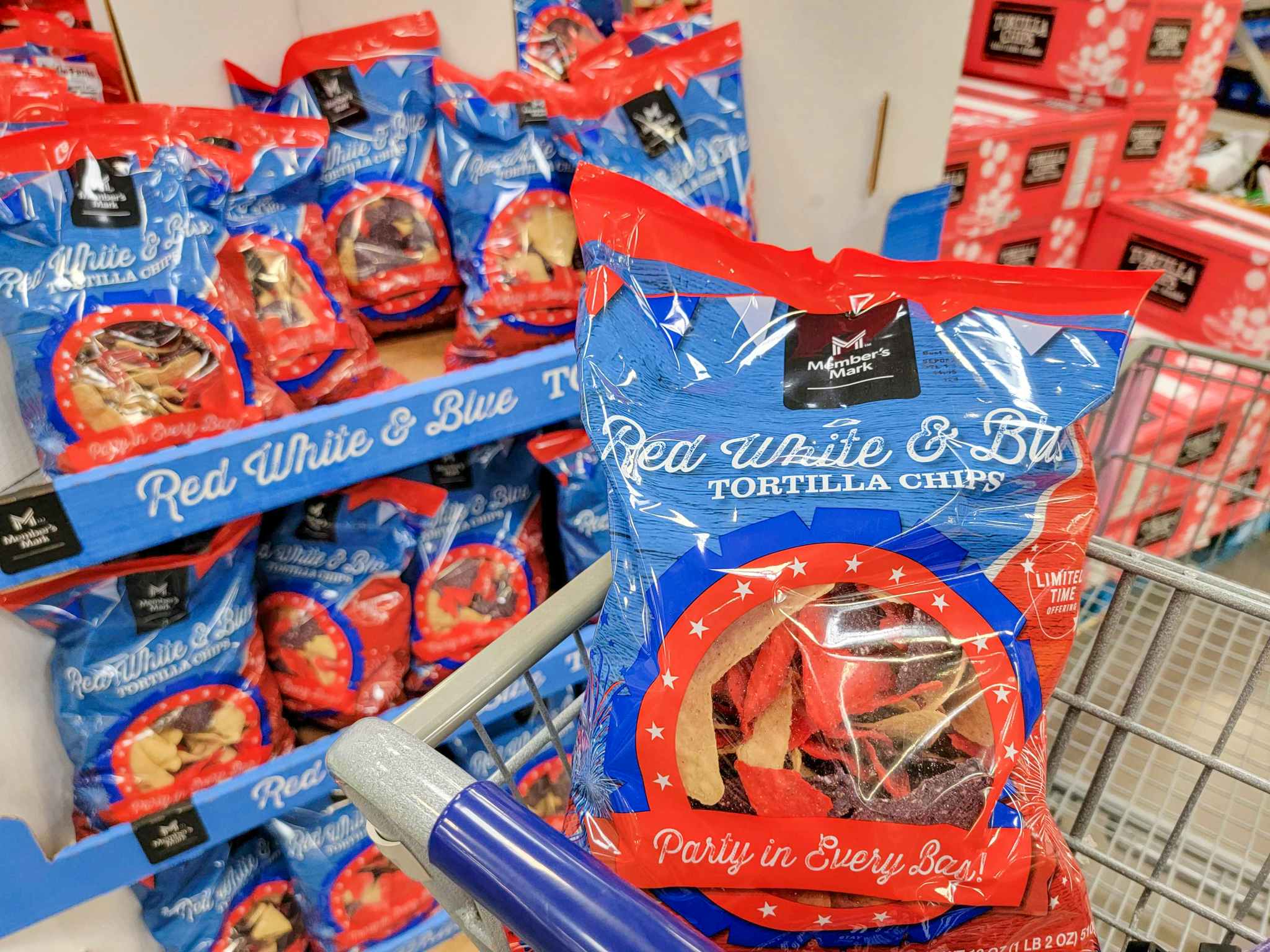 red, white, and blue tortilla chips in a cart