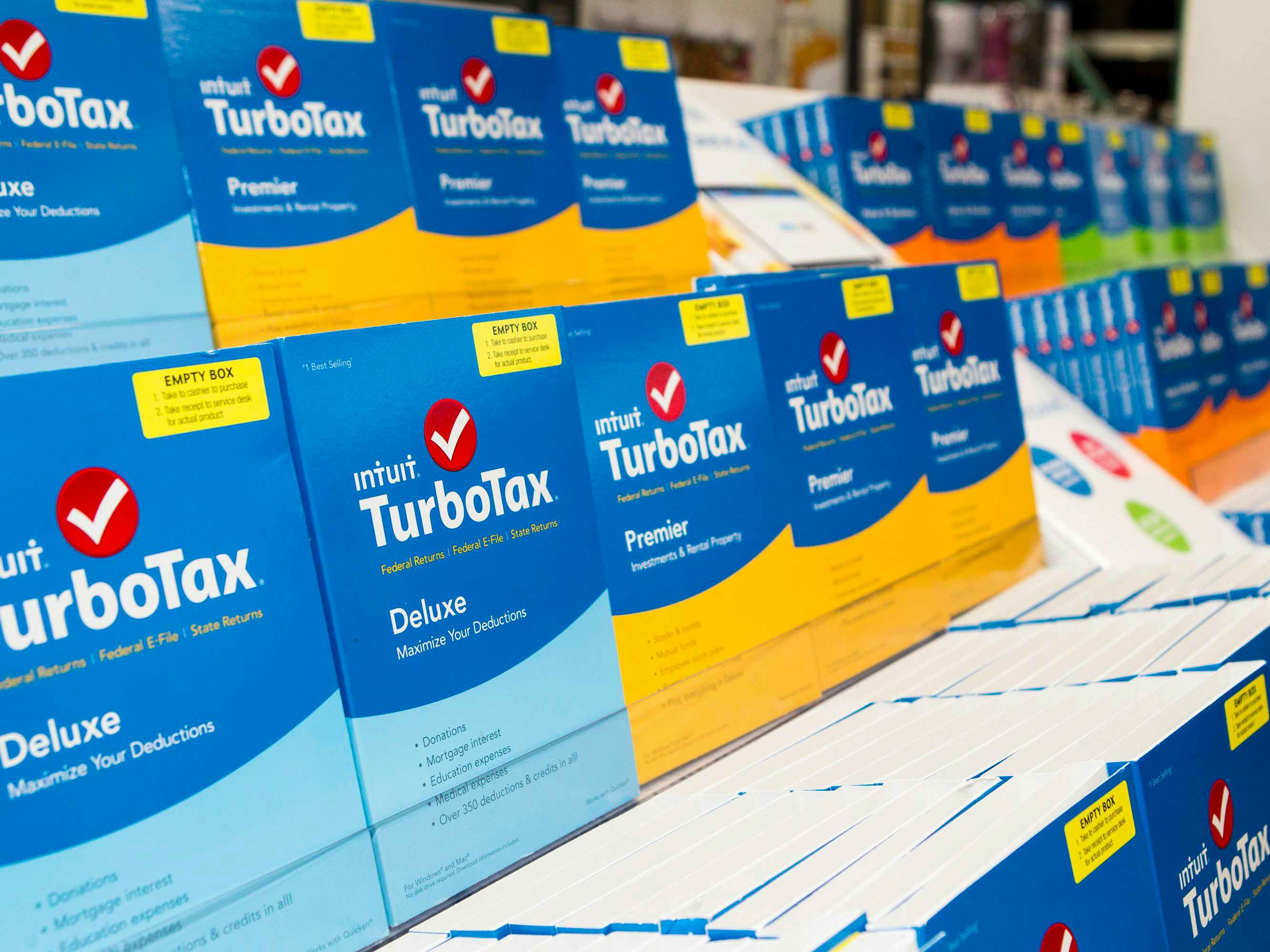 Boxes of TurboTax Deluxe and Premier software on display inside a store.