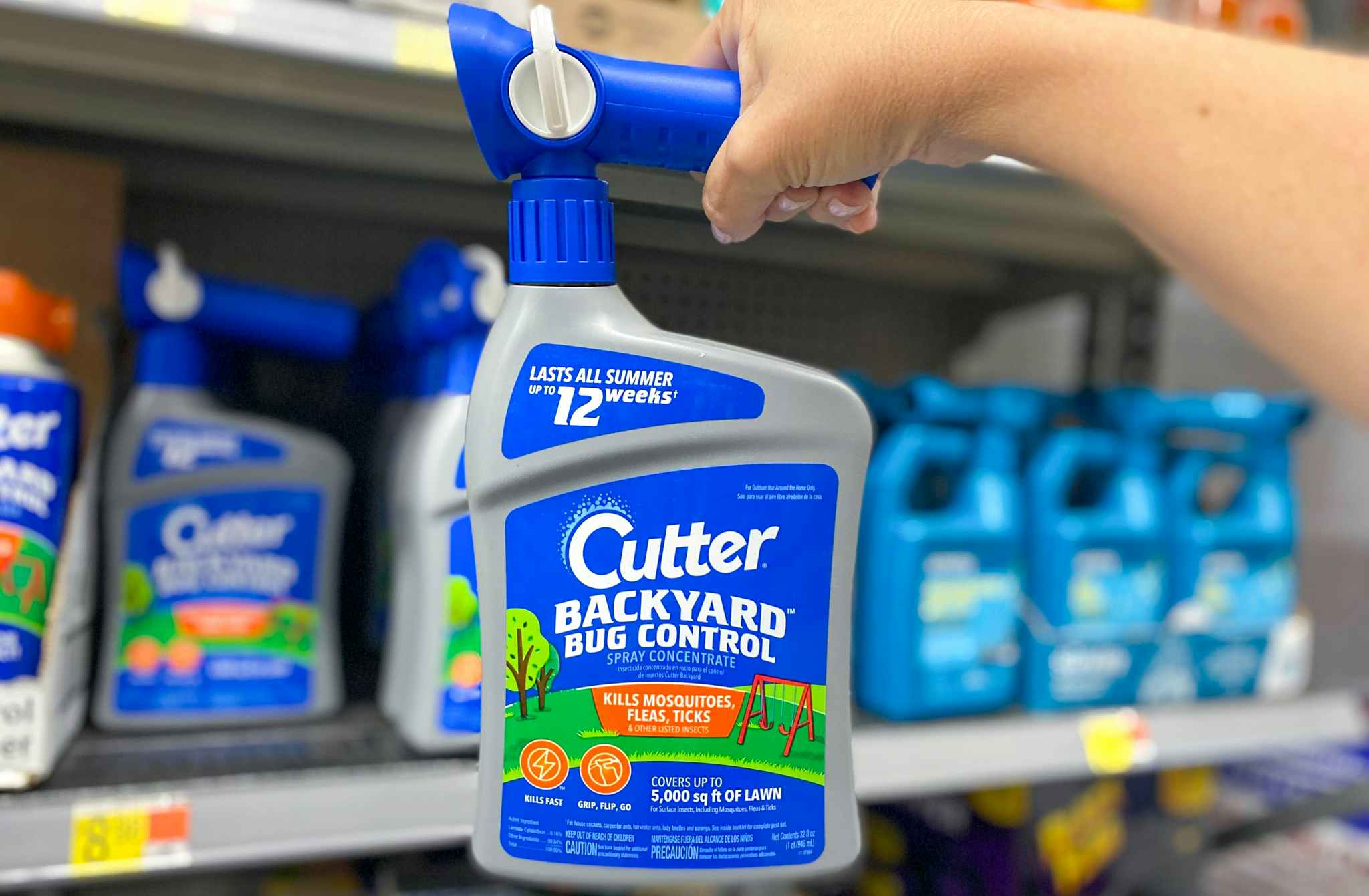 walmart cutter backyard bug control hand holding