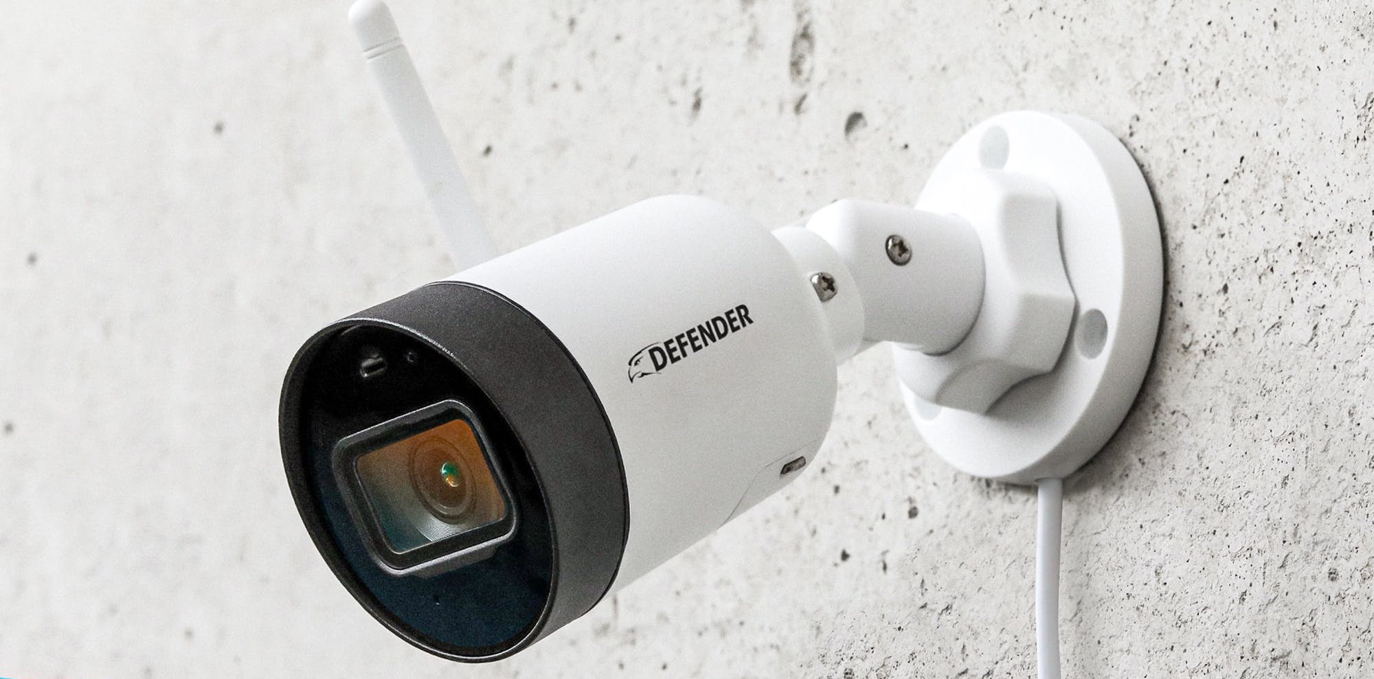 Walmart Defender Guard security camera mounted on a wall.