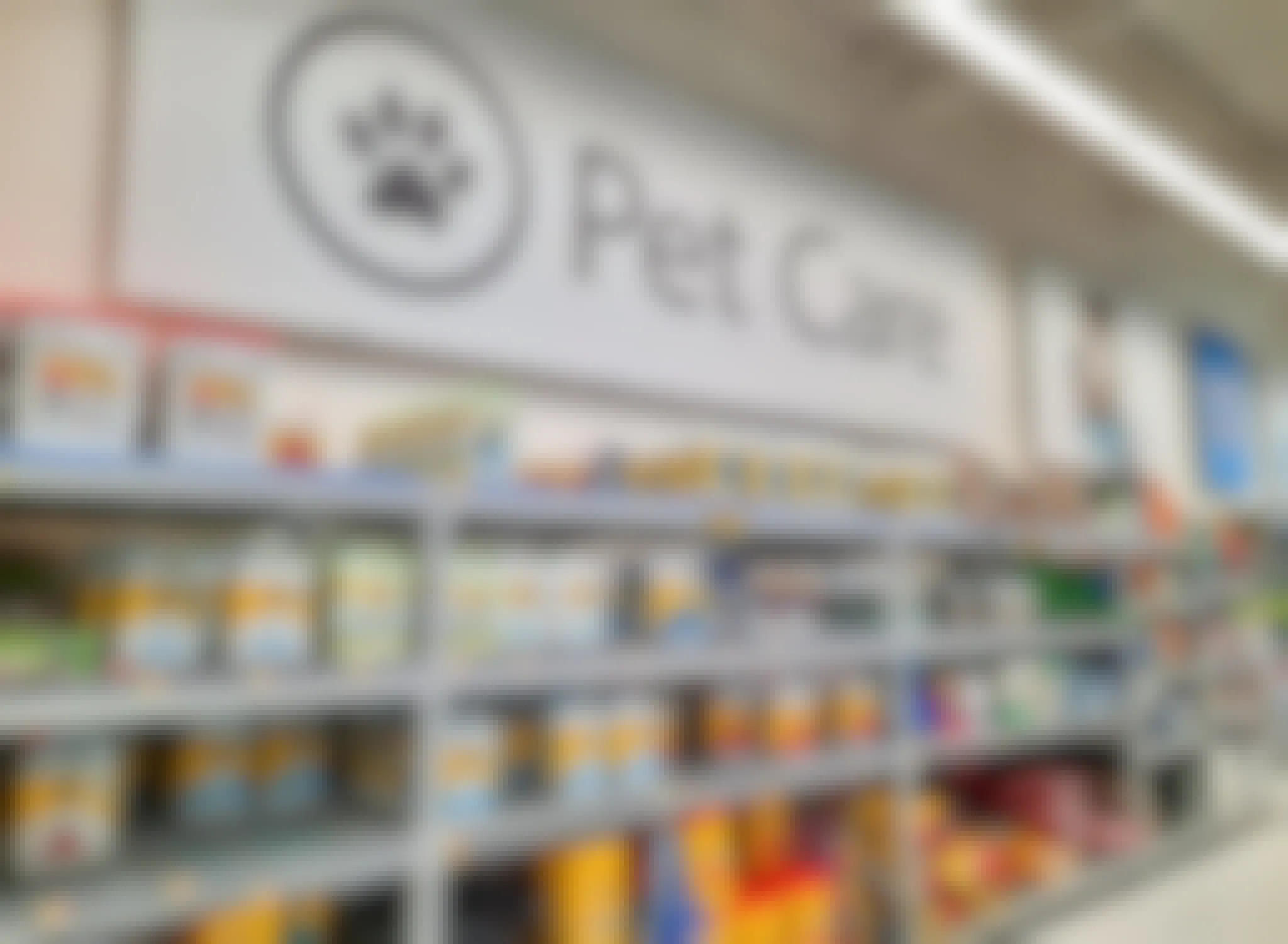 Pet Care sign above cat litter products at Walmart
