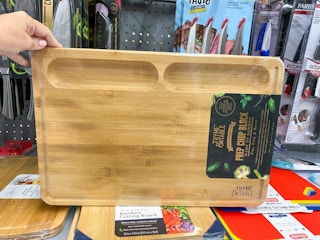 walmart thyme and table bamboo chop block hand holding