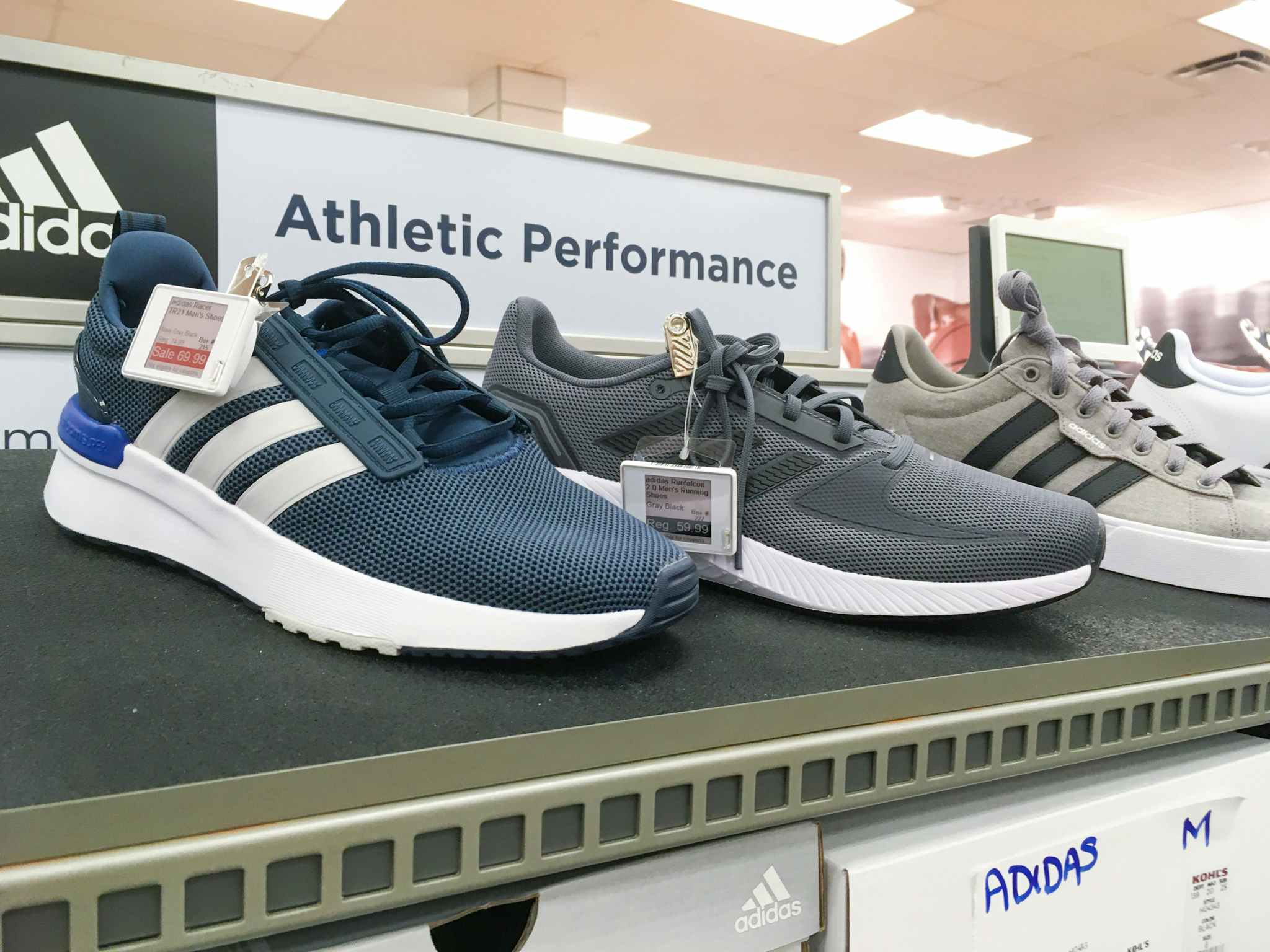 Adidas sneakers on display in the shoe section of Kohl's