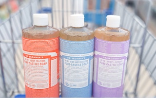shopping cart with three bottles of Dr. Bronner's castile soap inside