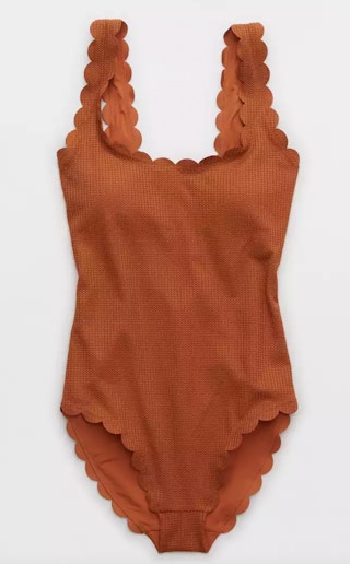 a brown one piece swimsuit with scalloped edges