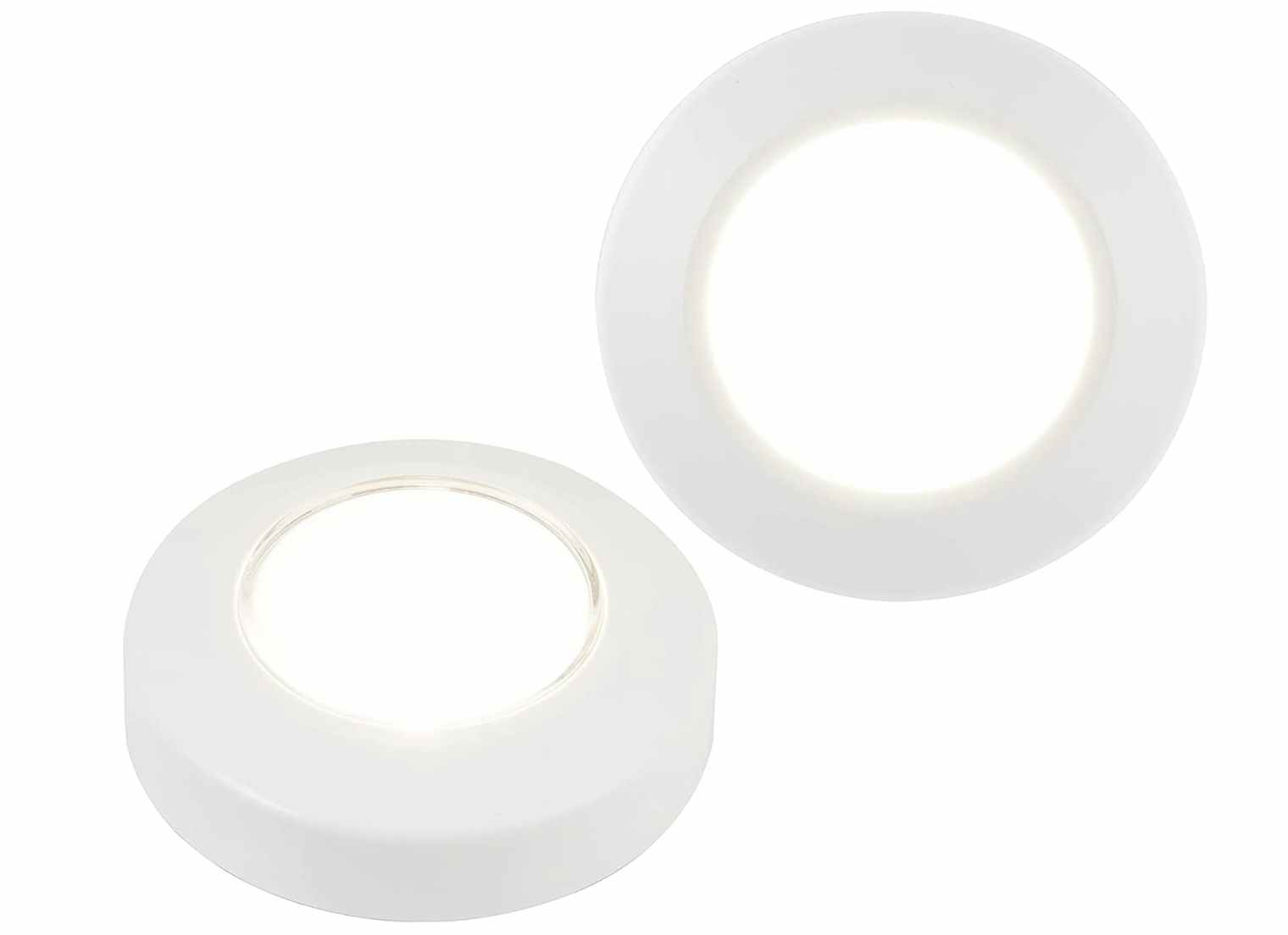Two round LED lights on a white background