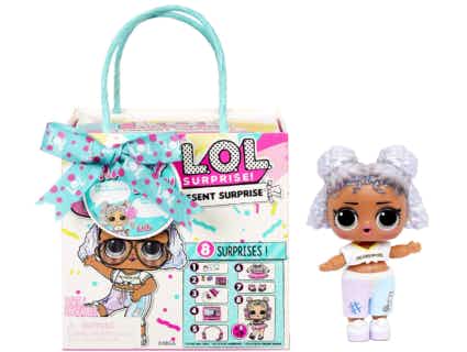 Colorful present bag packaging next to a doll
