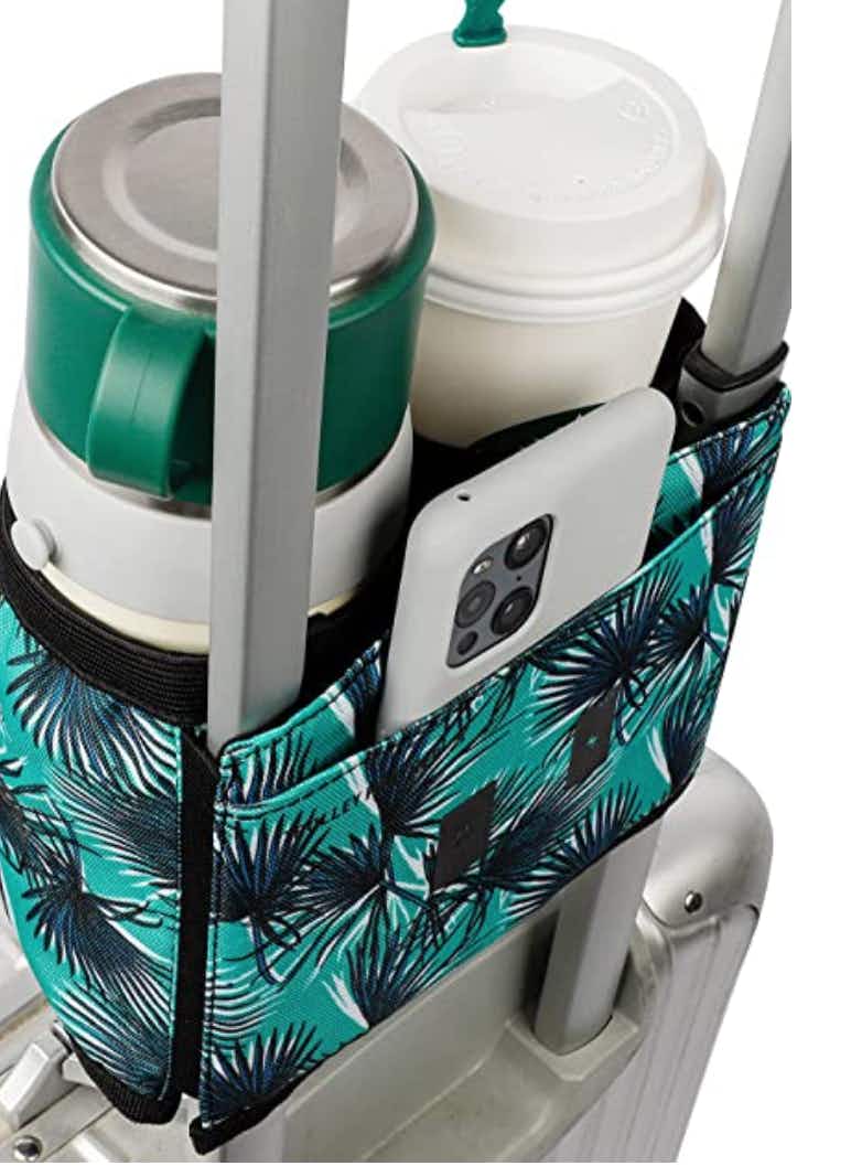 Cup holder with leaves on a luggage handle