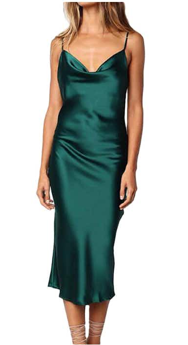 A green satin dress on white background
