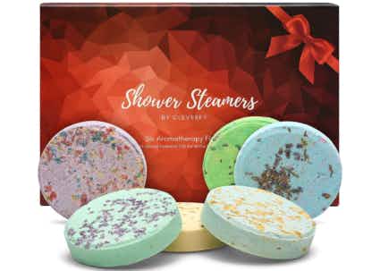 Red and clack box behind 6 colorful shower steamers