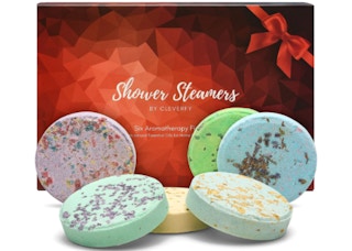 Red and clack box behind 6 colorful shower steamers