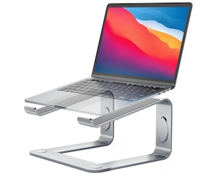 Silver laptop stand holding a laptop on a white background