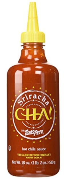 A stock image of a bottle of Cha! brand sriracha hot sauce.
