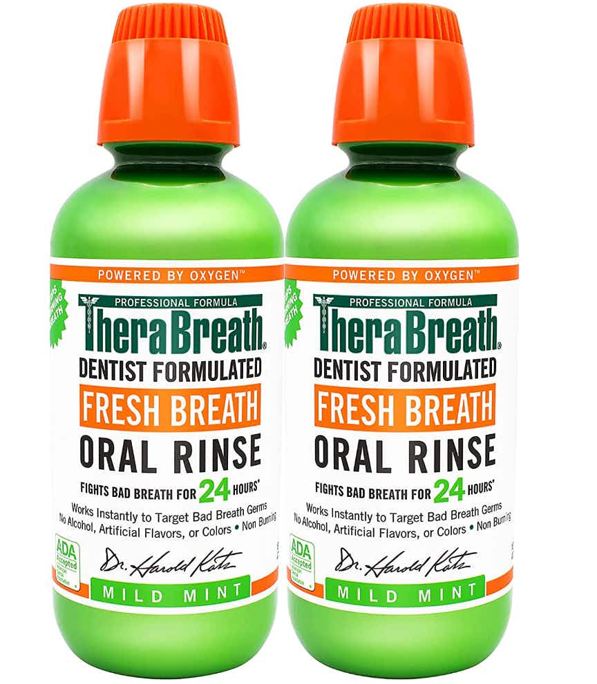 Two bottles of Therabreath Oral Rinse on white background
