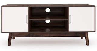 A wood TV stand with white doors