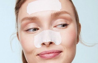 woman with biore pore strips on her forehead and nose