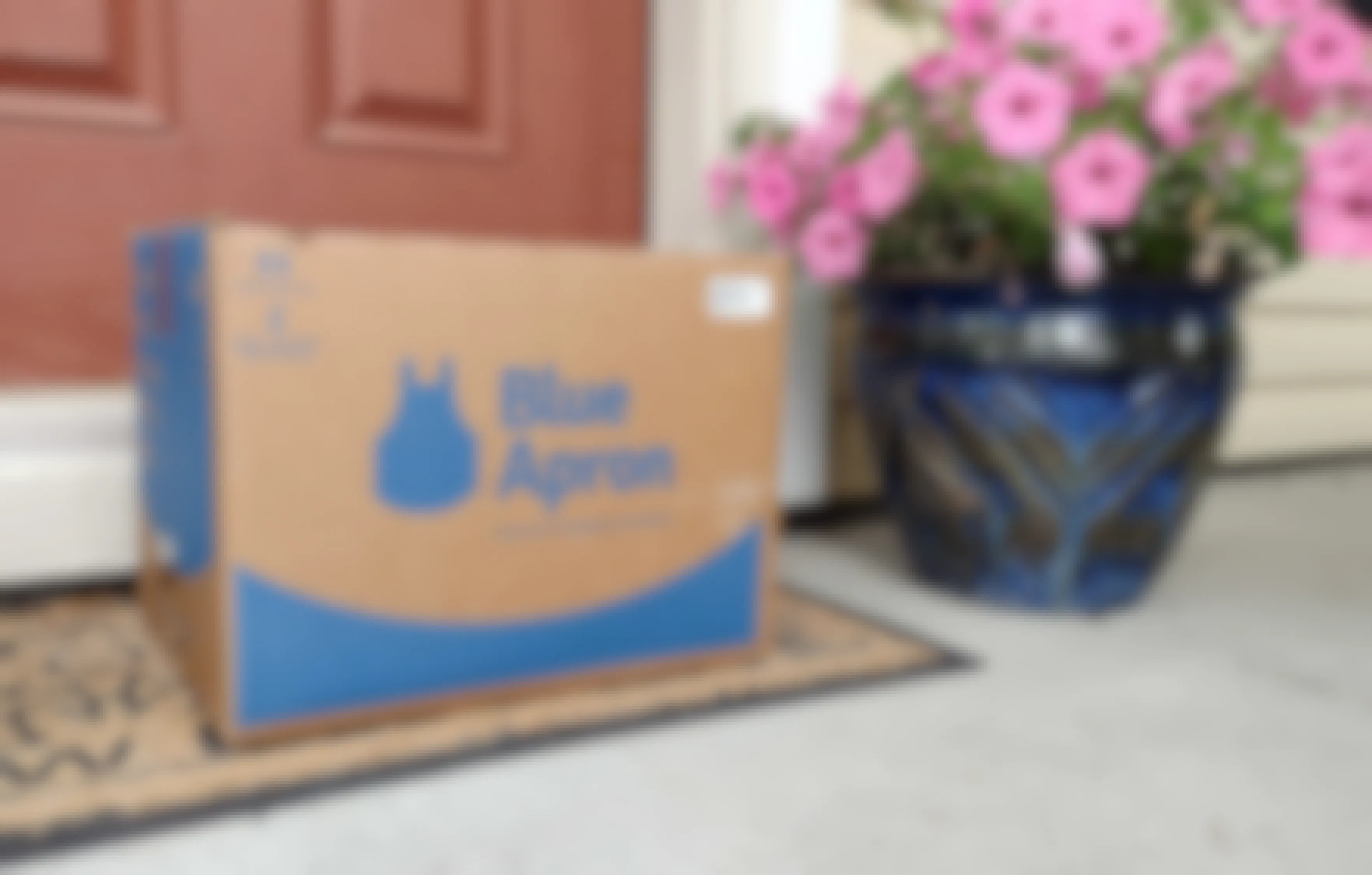 blue apron box on front step