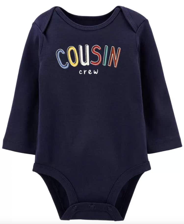 a baby bodysuit that says cousin crew 