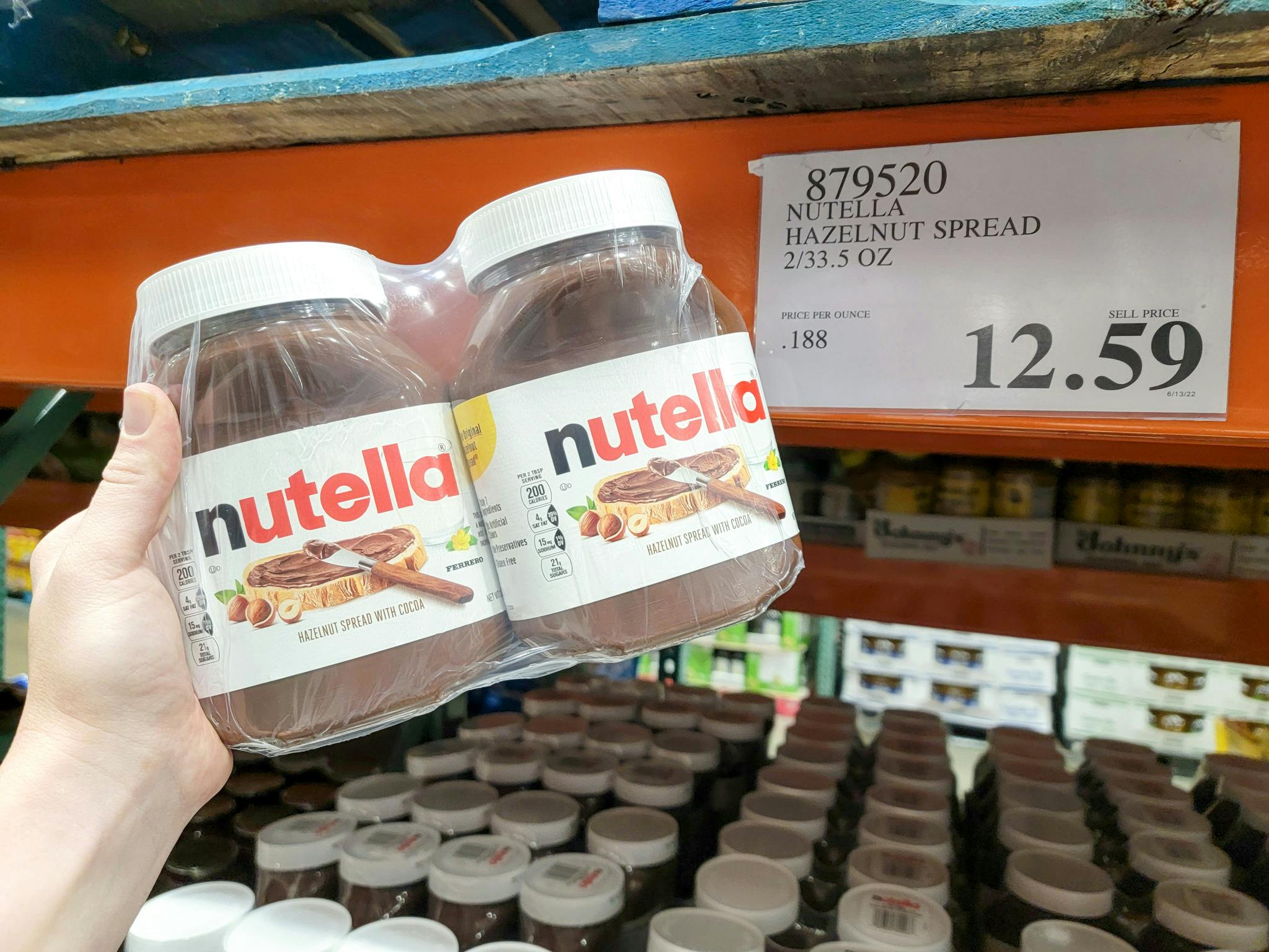 hand holding a 2-pack of nutella