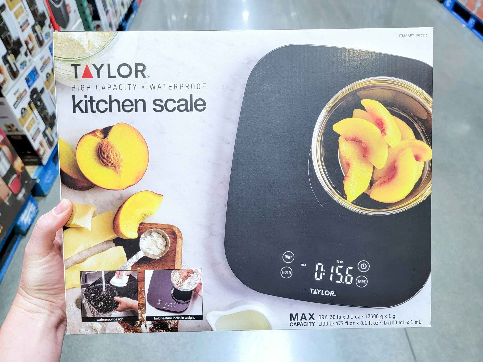 hand holding a taylor kitchen scale