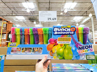 hand holding a pack of bunch o balloons