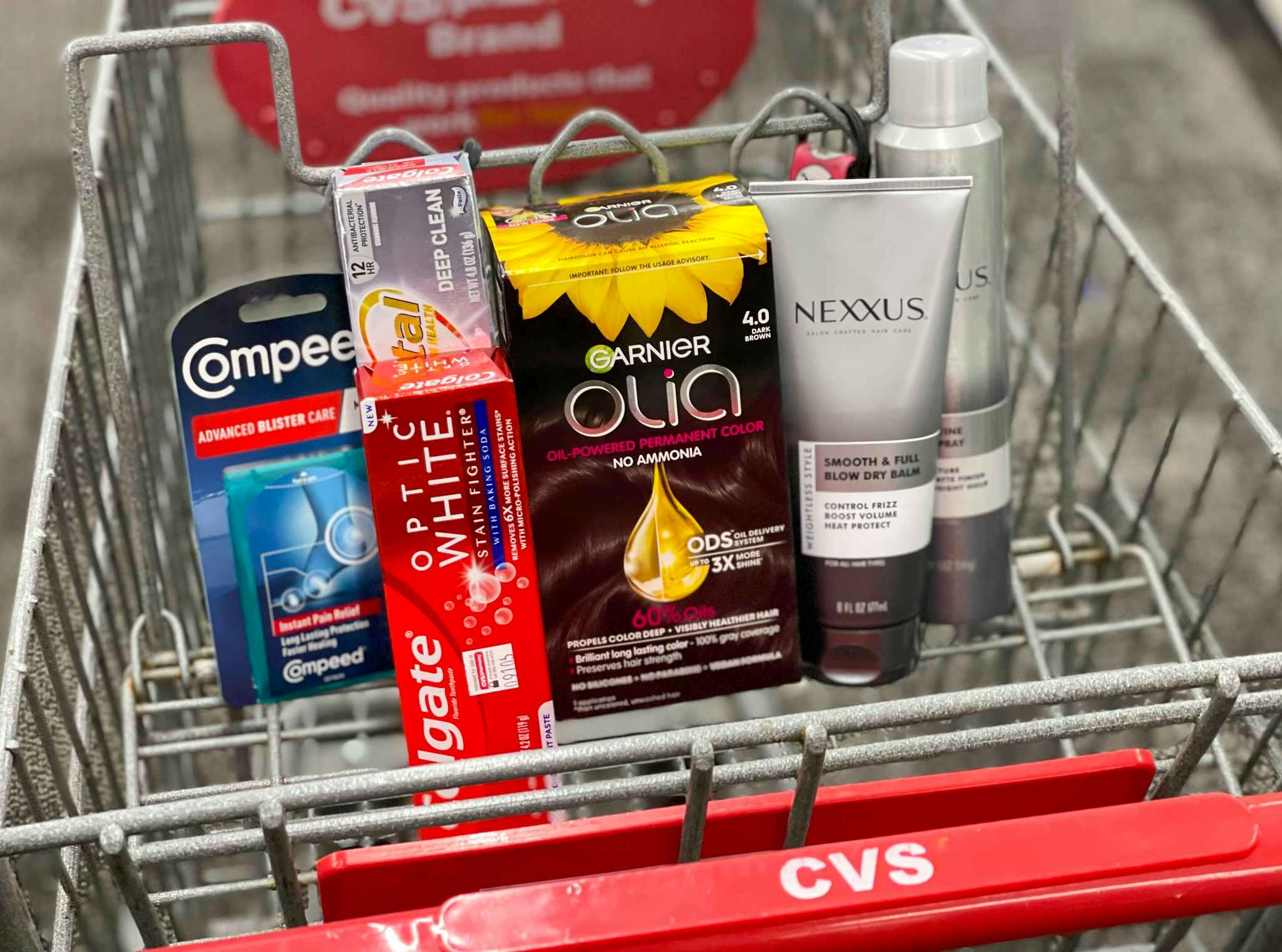 compeed, colgate, olia, and nexxus in cvs shopping cart
