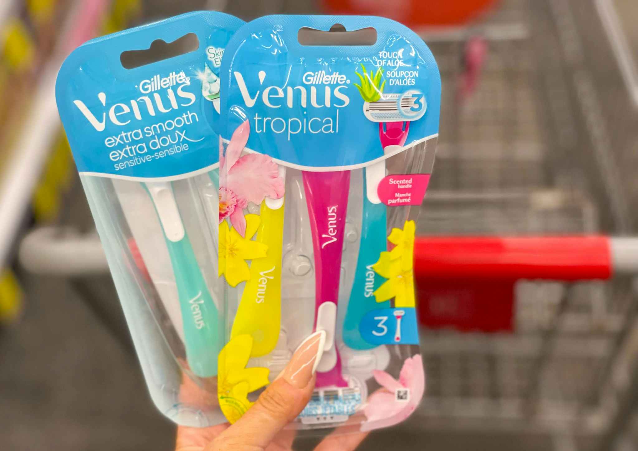 venus disposable razors held in hand