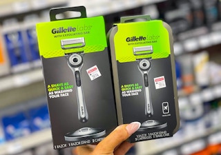 hand holding two gillettelabs razors