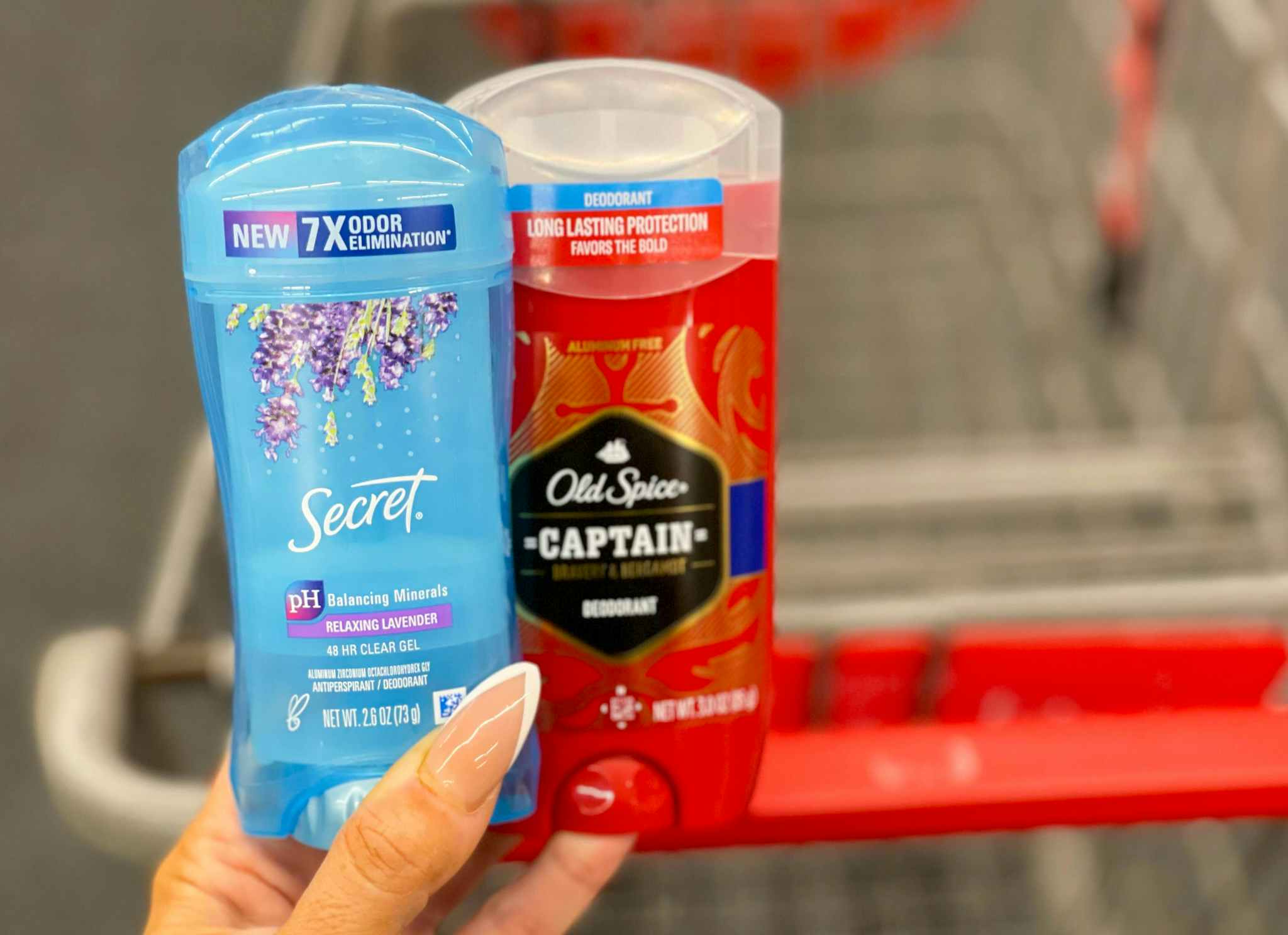 secret and old spice deodorant held in hand