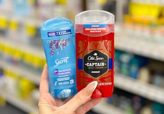 secret and old spice deodorant held in hand