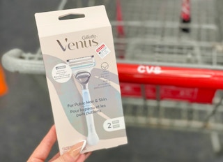 venus pubic hair razor held in hand