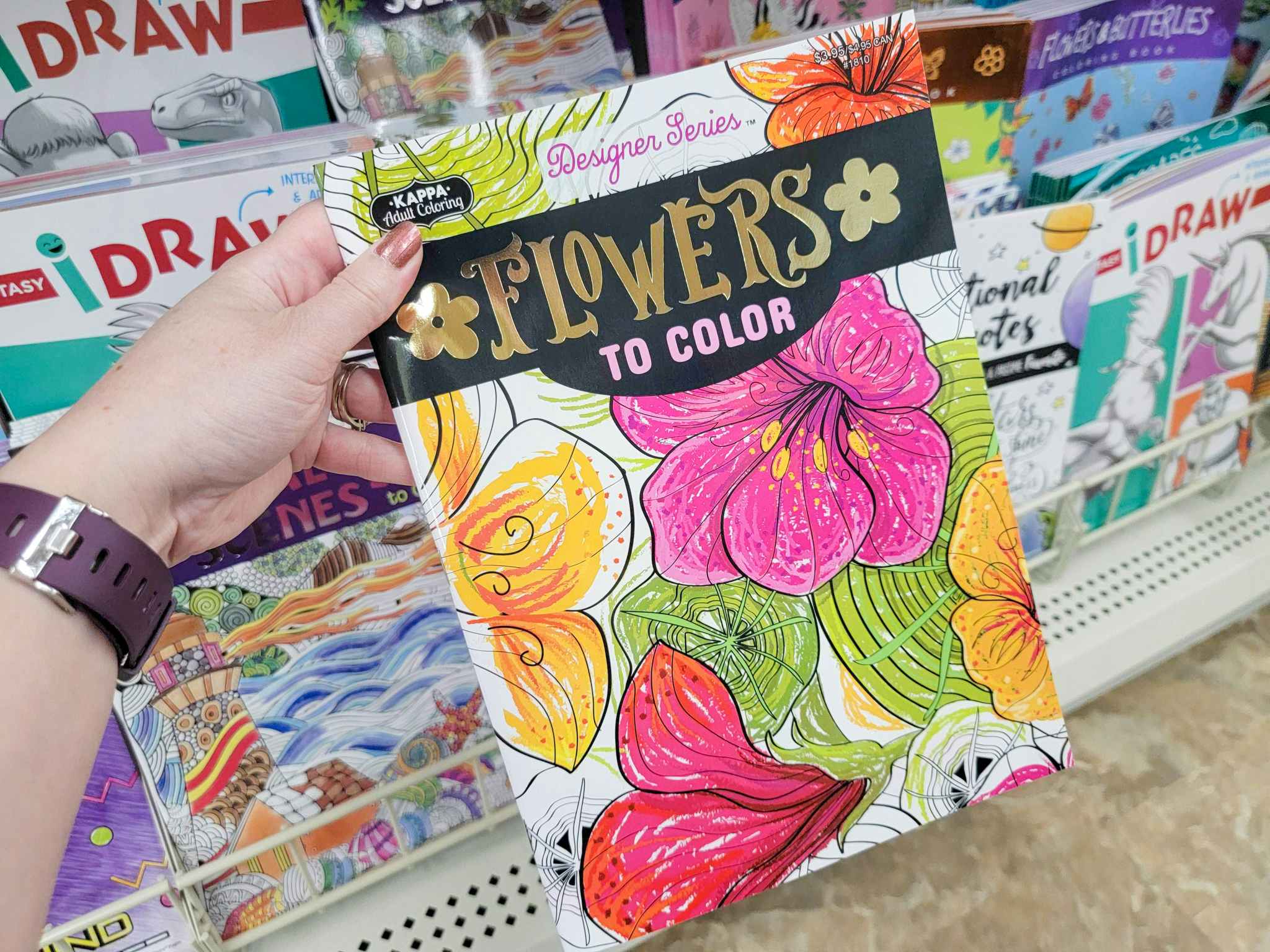 hand holding a flowers to color adult coloring book