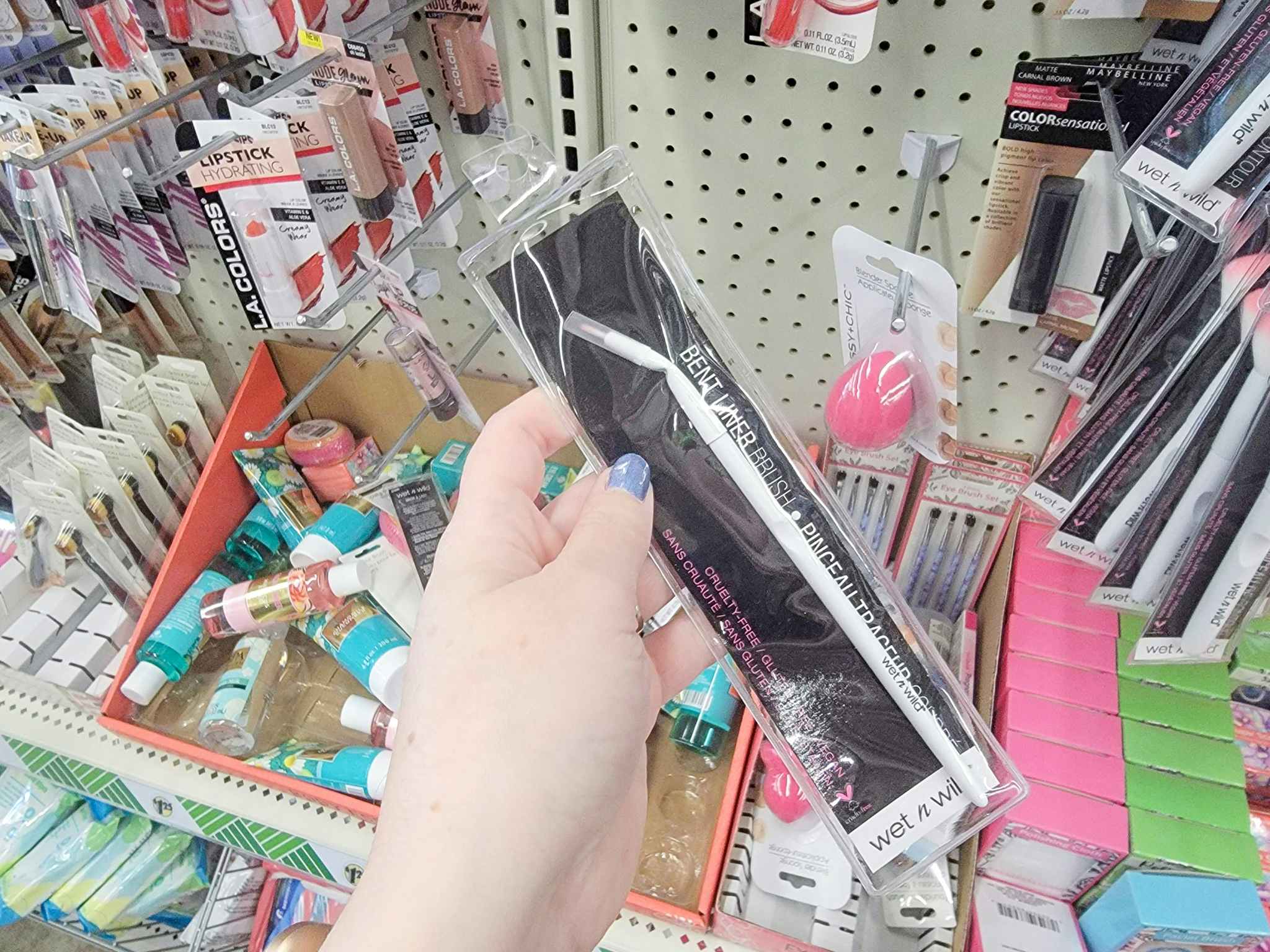 hand holding a wet n wild liner brush