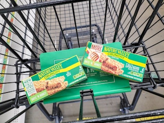 Two boxes of Nature Valley Granola bars in a Dollar Tree cart
