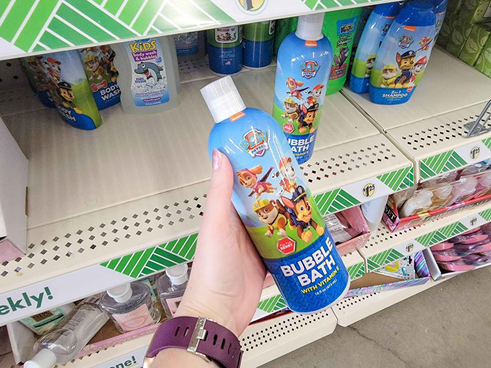 hand holding a bottle of paw patrol bubble bath