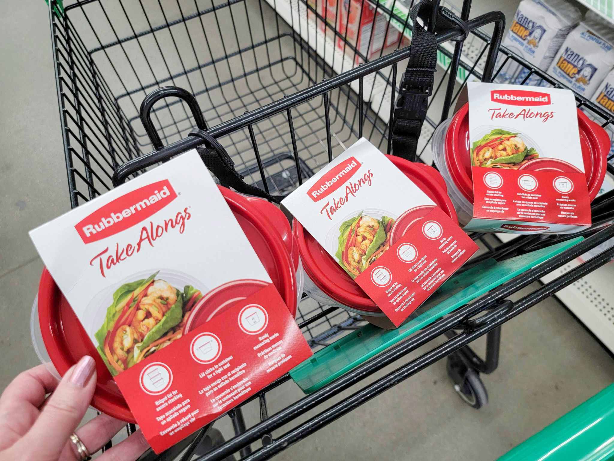 Three Rubbermaid Take Along Container Sets in a cart